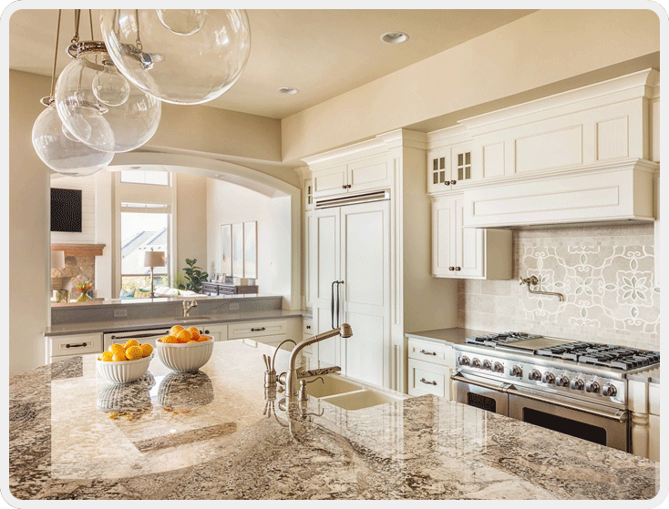 A kitchen with a sink, oven and microwave.