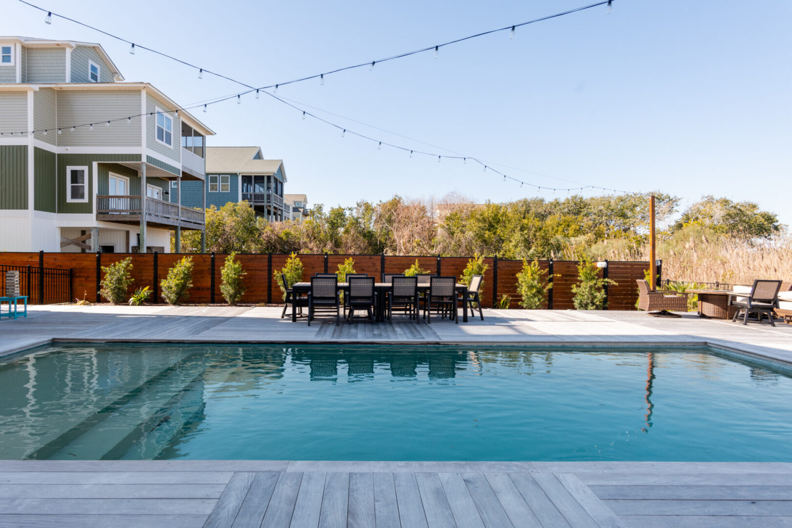 A pool with a table and chairs in the middle of it