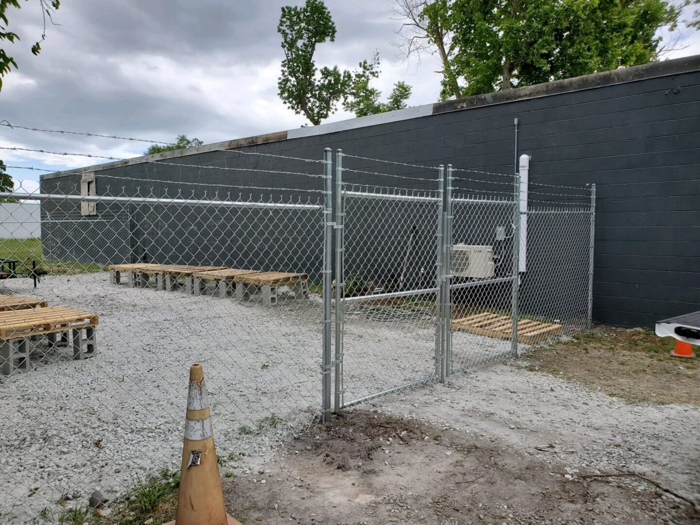 A fence that has been built around the perimeter of a building.